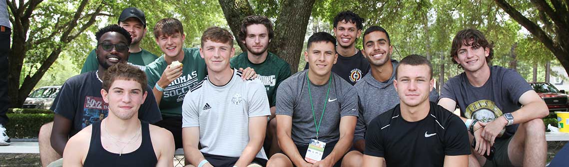 group of TU students watching a flag football game