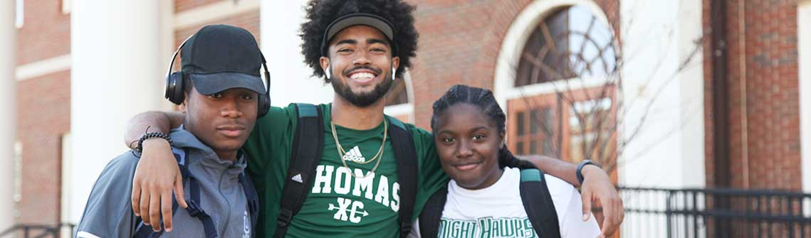 photo of three Thomas University students on Forbes Campus